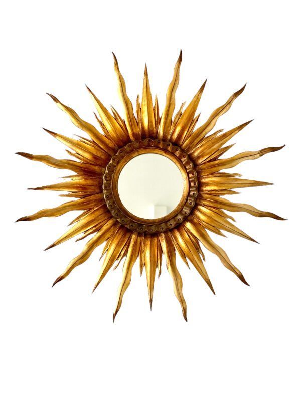 Miroir mural en bois doré à motif soleil