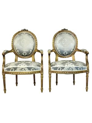 Pair of Louis XVI Medallion Carved and Gilded Wood Armchairs
