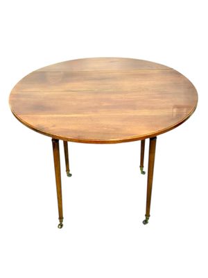 Table à abattants en merisier français du début du XIXe siècle sur roulettes en bronze doré