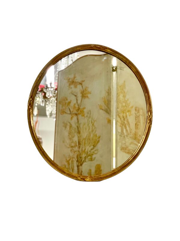 Miroir mural ovale en bois doré sculpté du XXe siècle