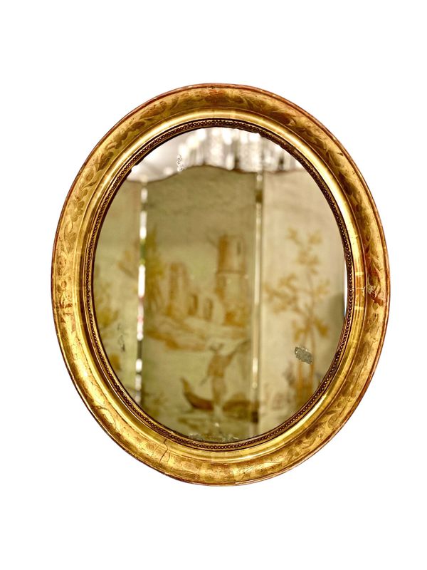Miroir mural ovale doré du XIXe siècle