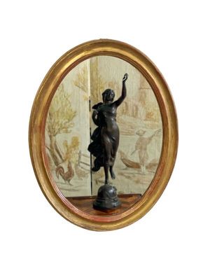 Miroir ovale mural en bois doré