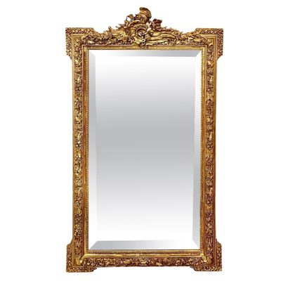 Miroir en bois doré richement décoré du XIXe siècle