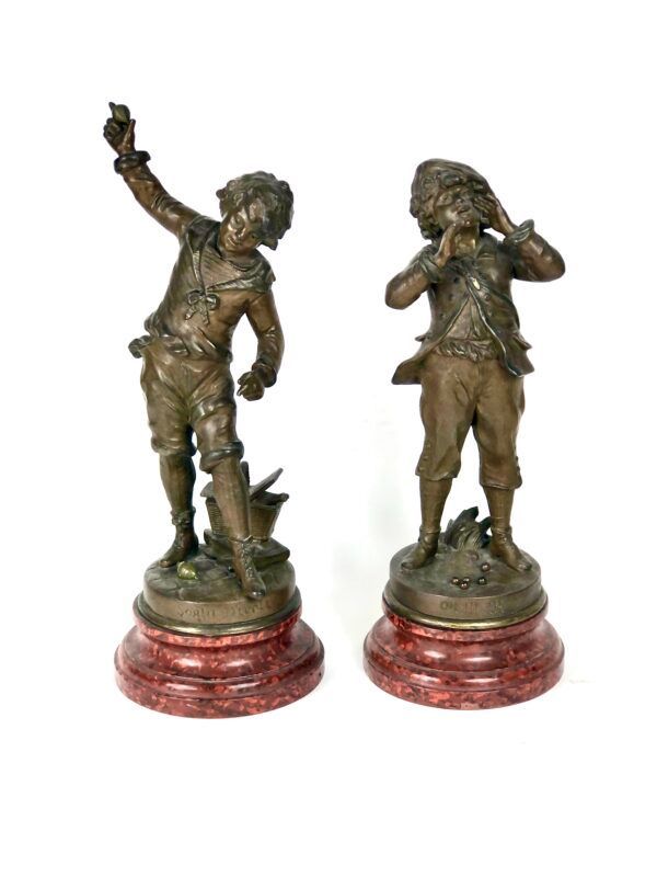 Louis Auguste Moreau Ensemble de deux sculptures en métal gris représentant des garçons XIXe siècle