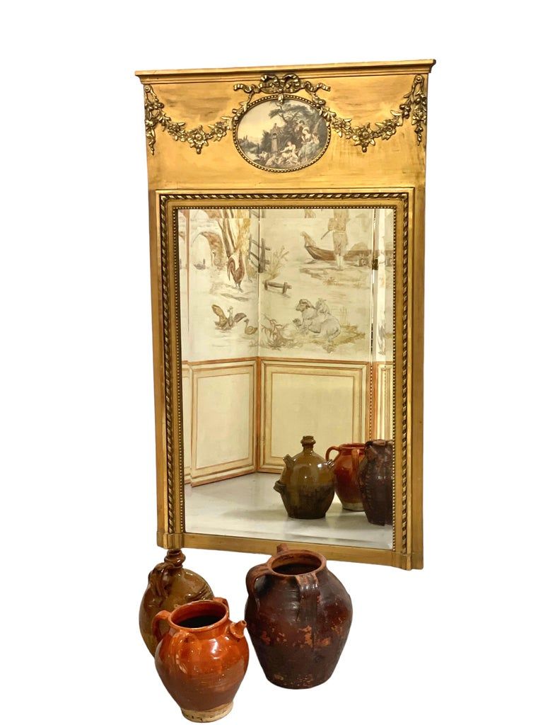 Miroir trumeau antique de style Louis XVI en bois doré