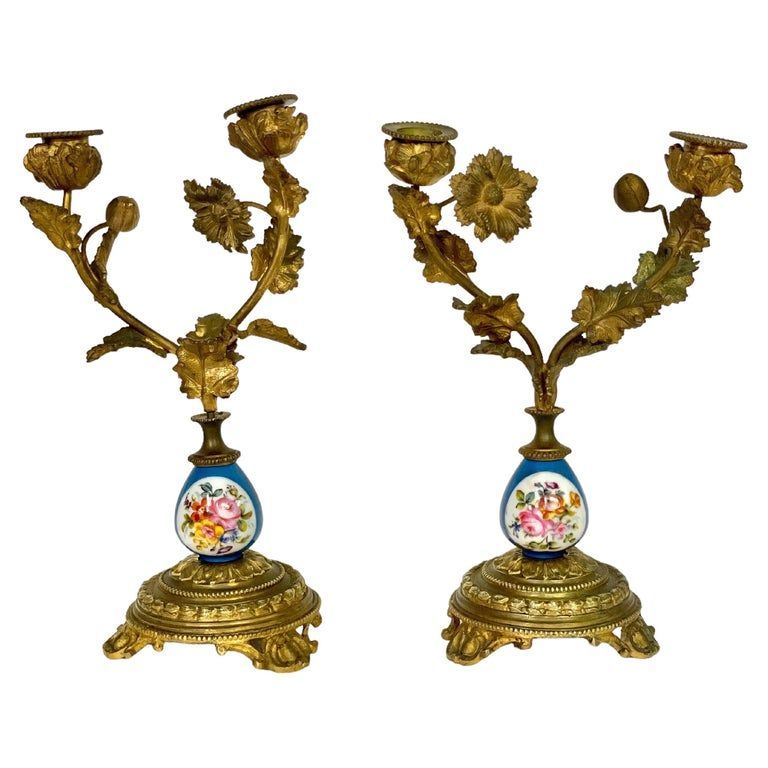 Paire de candélabres en bronze doré et porcelaine