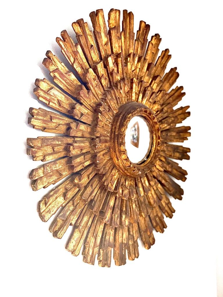 Impressionnant miroir convexe doré à la feuille d'or