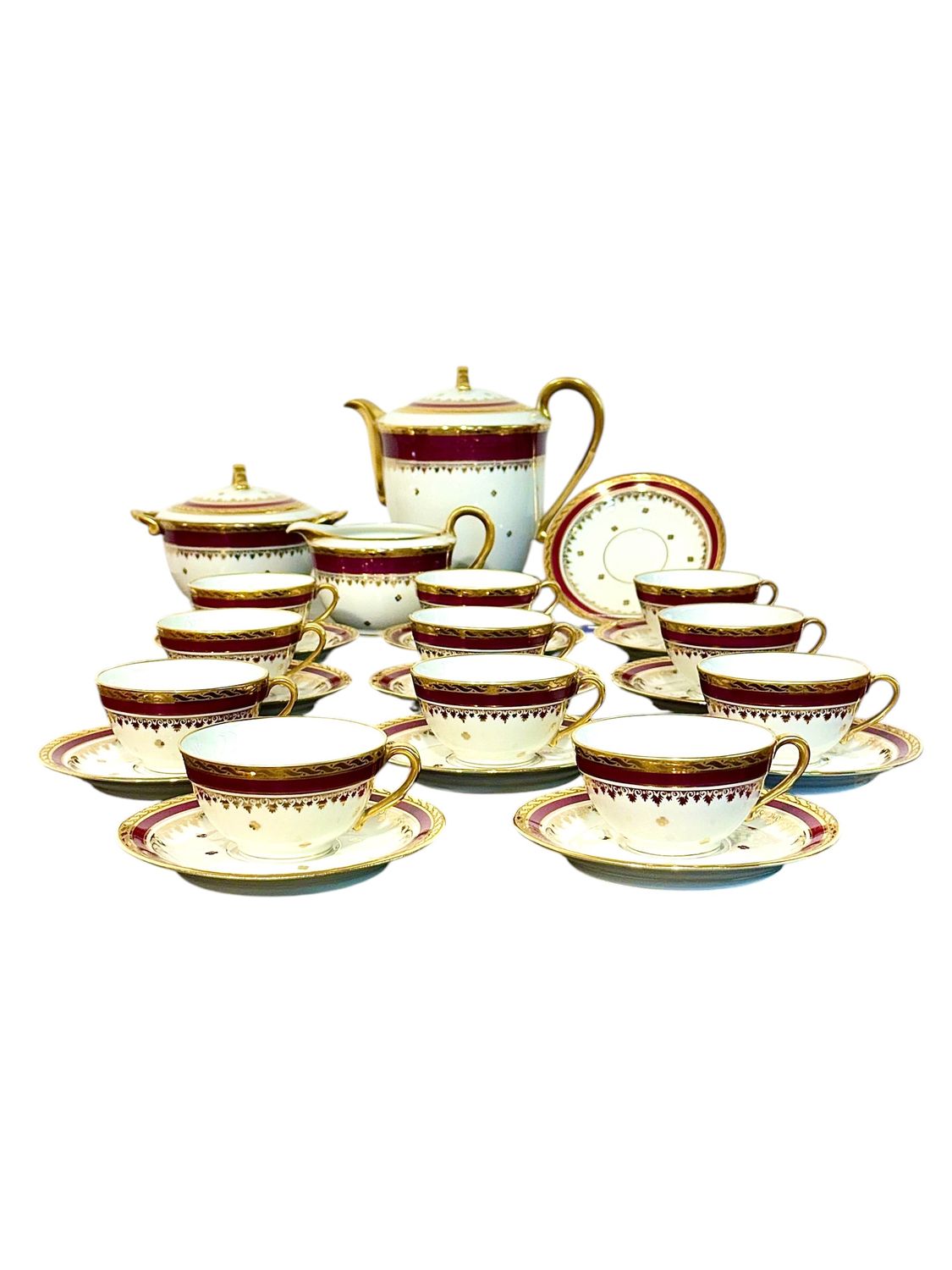 Service à thé Unique en porcelaine de Limoges, bordeaux et dorure, XXe siècle