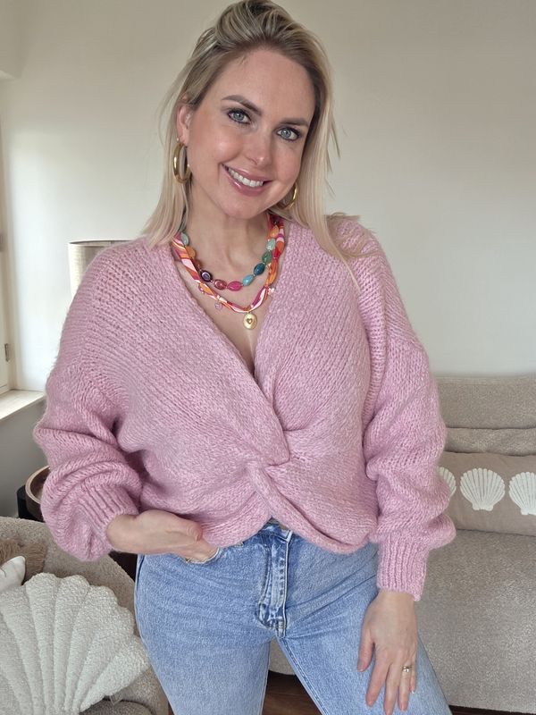 Gebreide trui met knoop detail roze