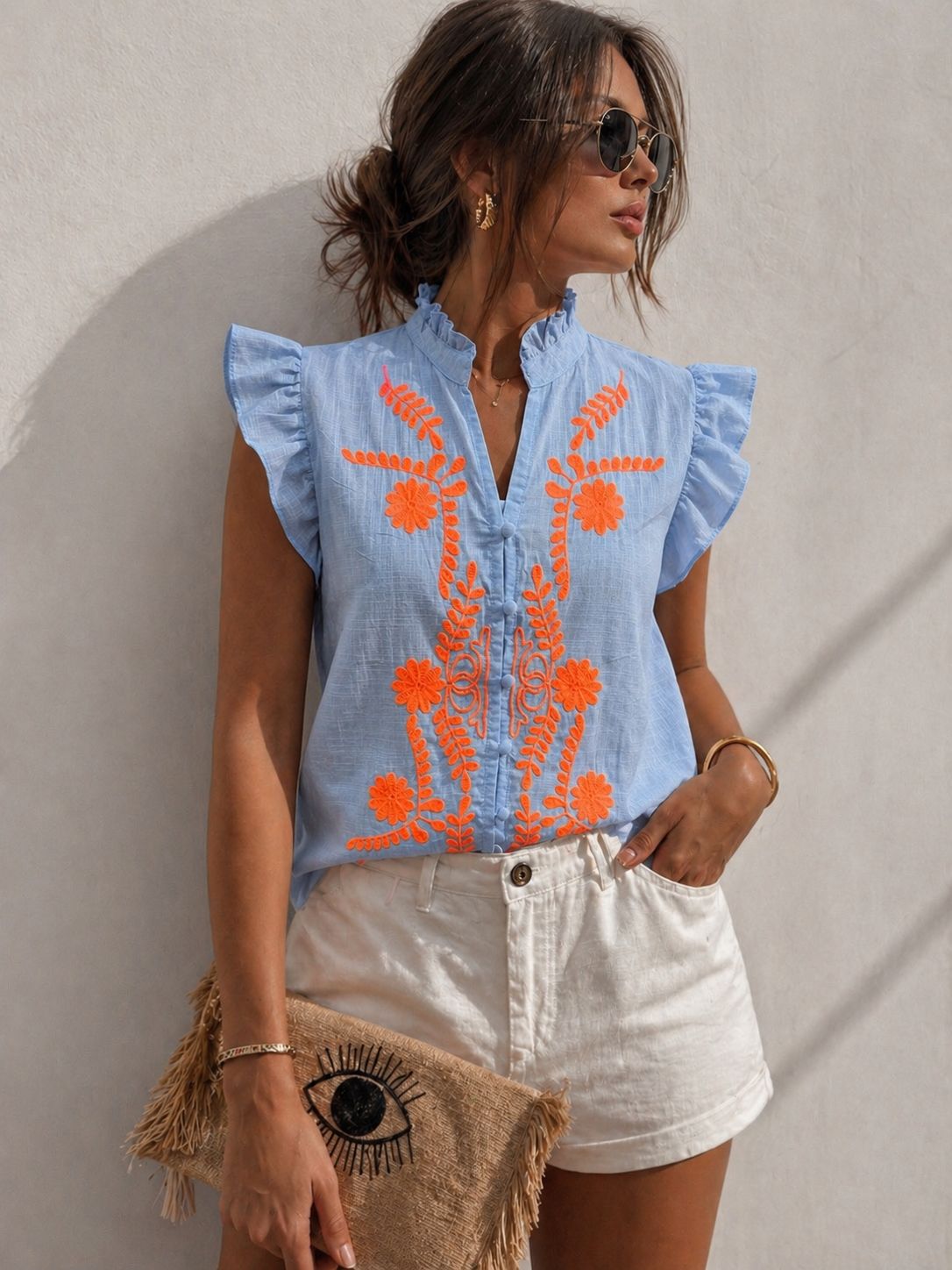 Blauw zomerblousje met oranje stiksels