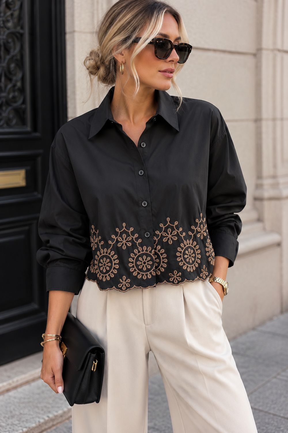 Zwarte blouse met bruine stiksels