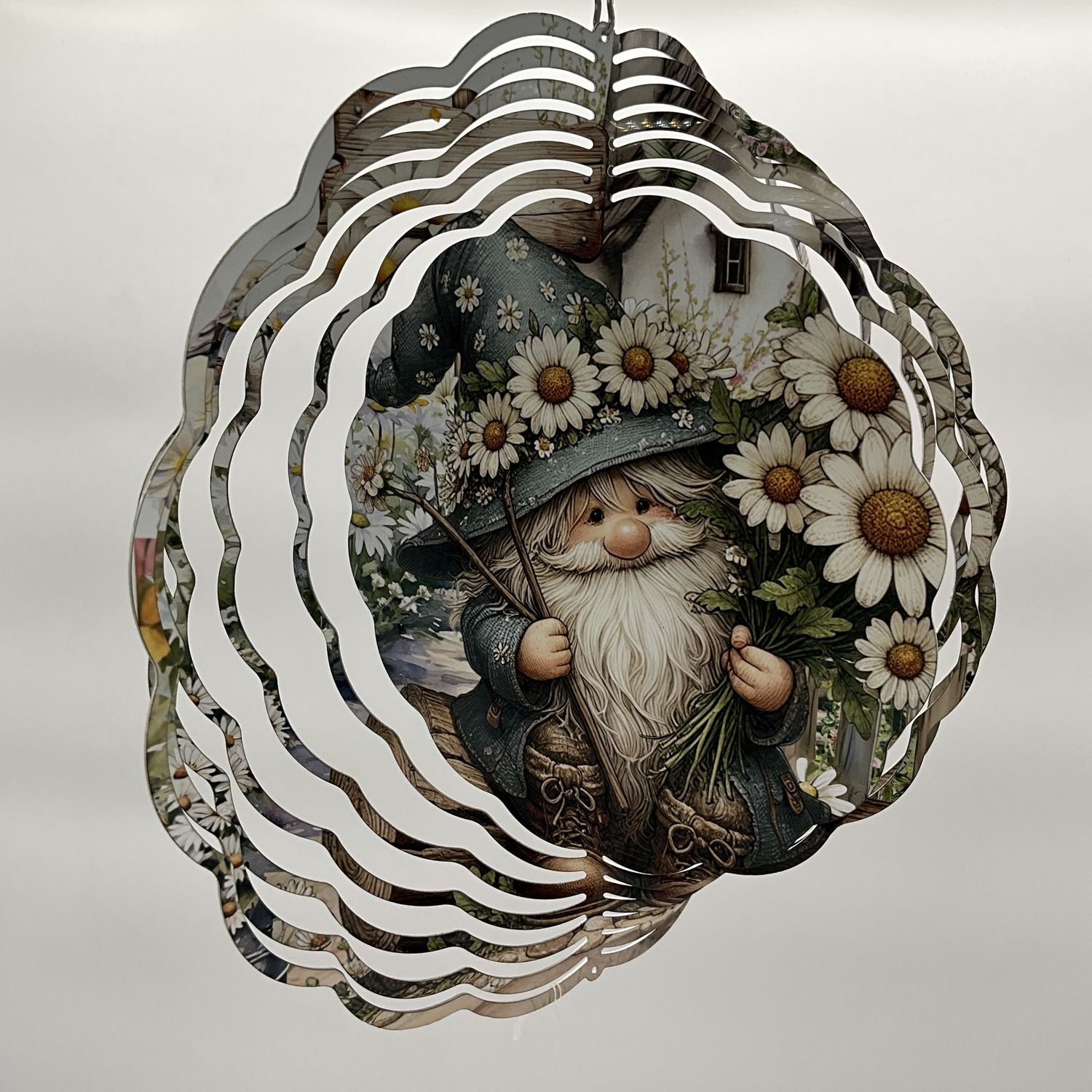 Gnome in blue  with white daisies, spinner
