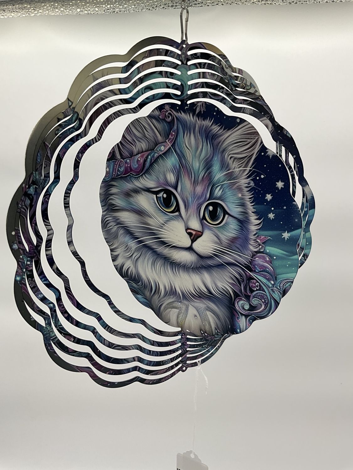 Whimsical cat wind spinner in blues