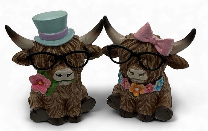 Highlander cows in pastel bows &amp; top hat
