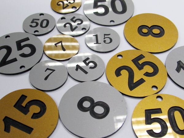 1.5mm 50mm round engraved laminate discs (€1.39 each)