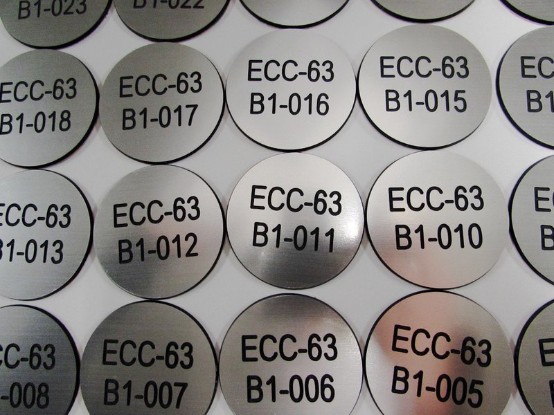 1.5mm 62.5mm round engraved laminate discs (€2.19 each)