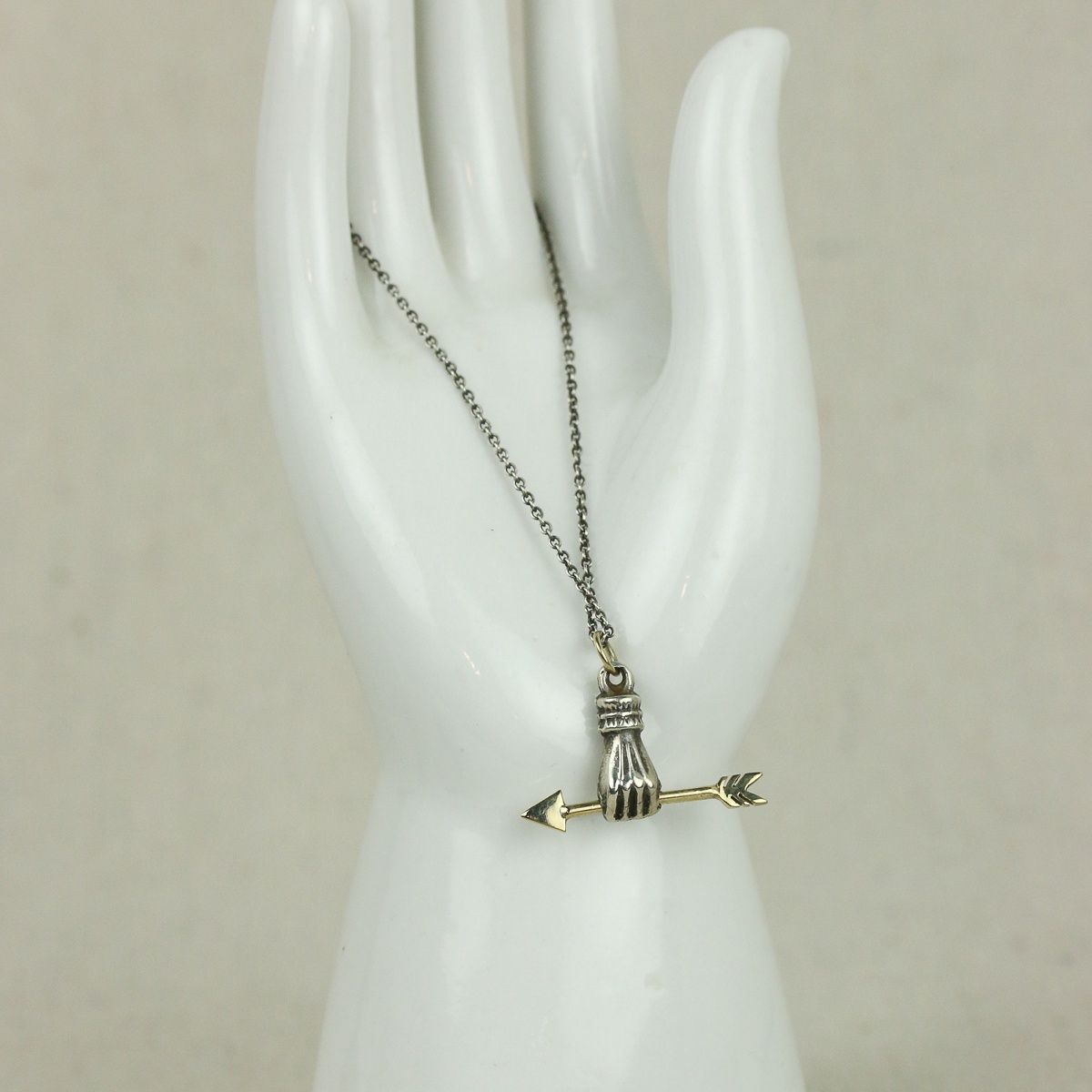 arrow in hand necklace