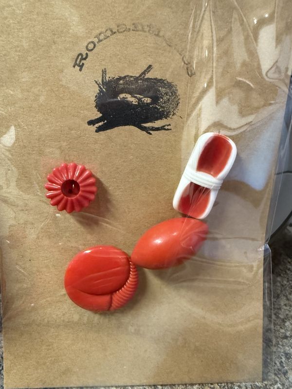 4 vintage red mid-century plastic buttons