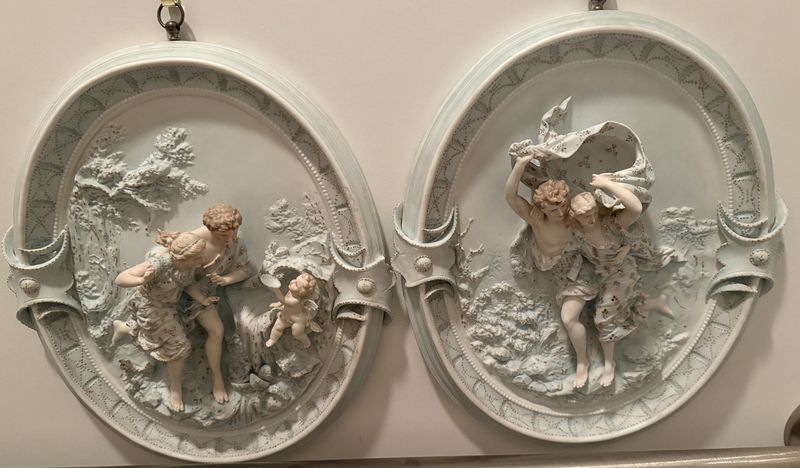 Pair of Porcelain 3-D figures Wall Plaques