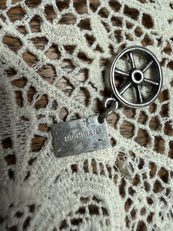 Sterling by Bell Wagon Wheel Charm with "Michigan" Tag