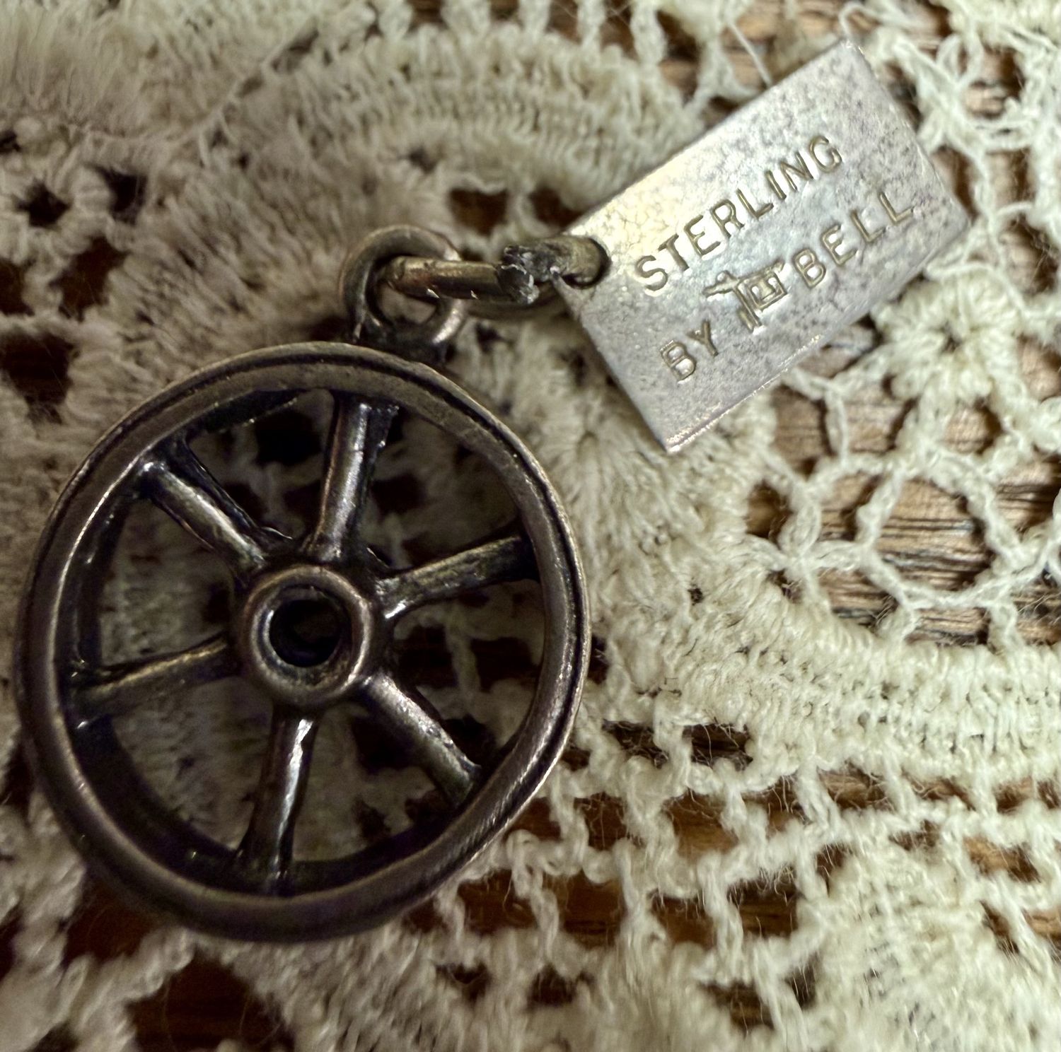 Sterling by Bell Wagon Wheel Charm with "Michigan" Tag