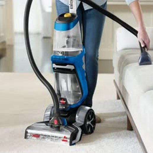 BISSELL ProHeat 2X Pet Carpet Cleaner removing pet stains from carpet in home setting