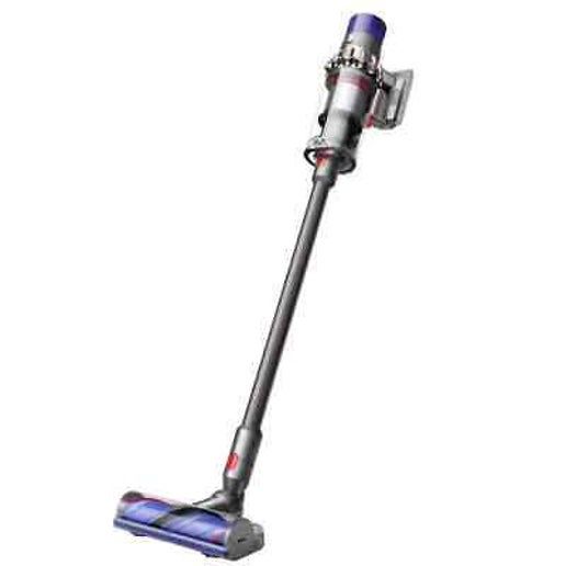 Dyson V10 Animal vacuum with all included accessories and attachments laid out
