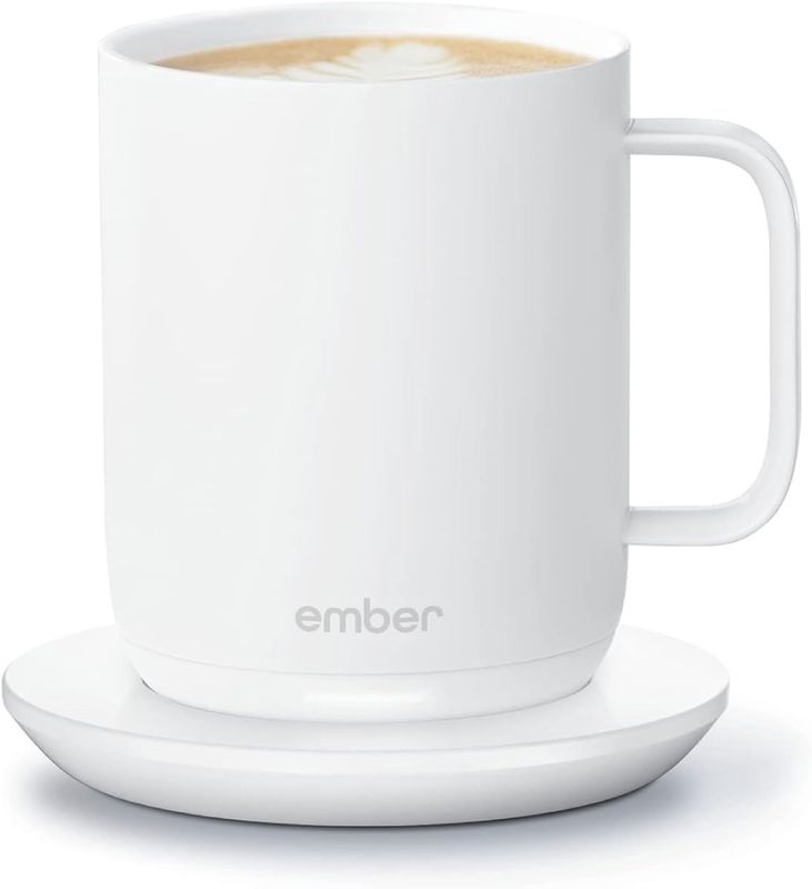 Ember Temperature Control Smart Mug on a white plate, highlighting the mug’s sleek design and modern style