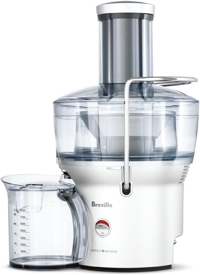 Front view of the Breville BJE200XL Juice Fountain Compact showing its compact design, wide feed chute, and juice container