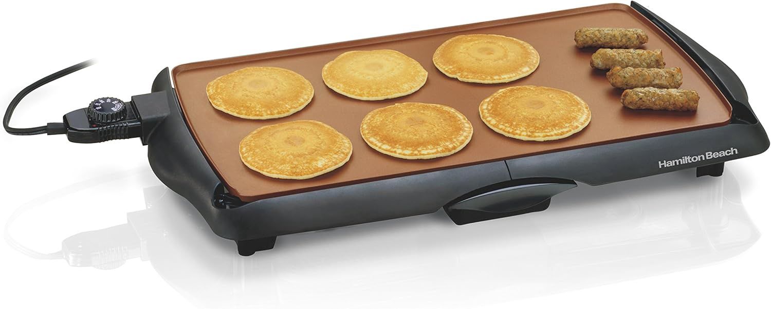 Hamilton Beach 38518R ceramic griddle with 200 sq. in. nonstick surface, cool-touch handles, and drip tray.