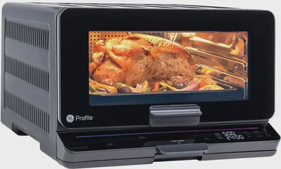 GE Profile UltraFast Smart Air Fry Oven in black, featuring a sleek design with a digital control panel and glass door.