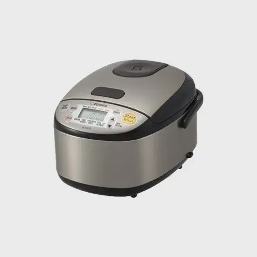 Front-facing view of the rice cooker highlighting the display panel and lid release button.