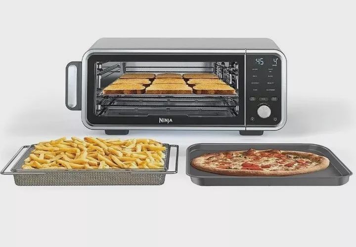 Front view of Ninja Foodi Convection Toaster Oven showing control panel, door and food.