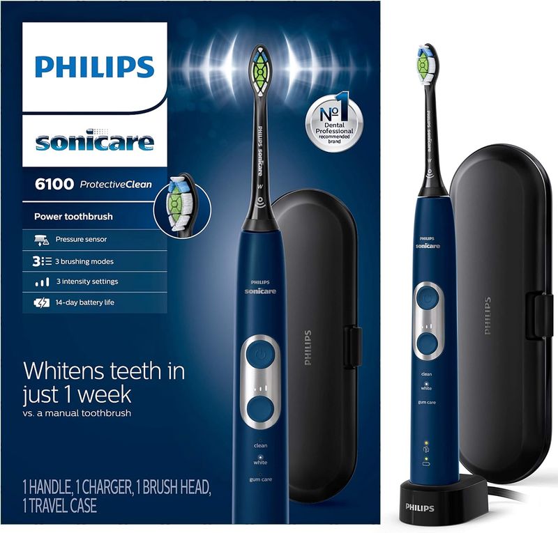 Philips Sonicare ProtectiveClean 6100 electric toothbrush positioned beside its packaging box on a clean surface.