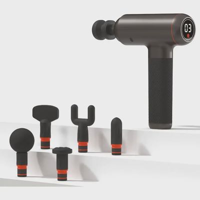 Sharper Image Powerboost massager with interchangeable heads and charging cable arranged together.