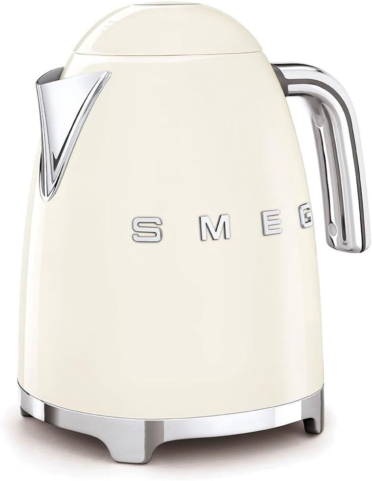 Angled view of the SMEG Retro Electric Kettle showing the front logo, handle, and spout in one frame.