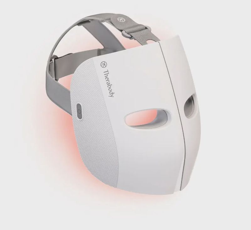 Therabody TheraFace Mask in white, front view showing LED light panels and facial contours.