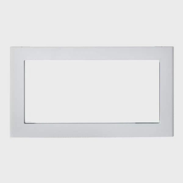 GE JX830DFWW 30‑inch built‑in microwave trim kit in white, featuring integrated metal frame and louvers.