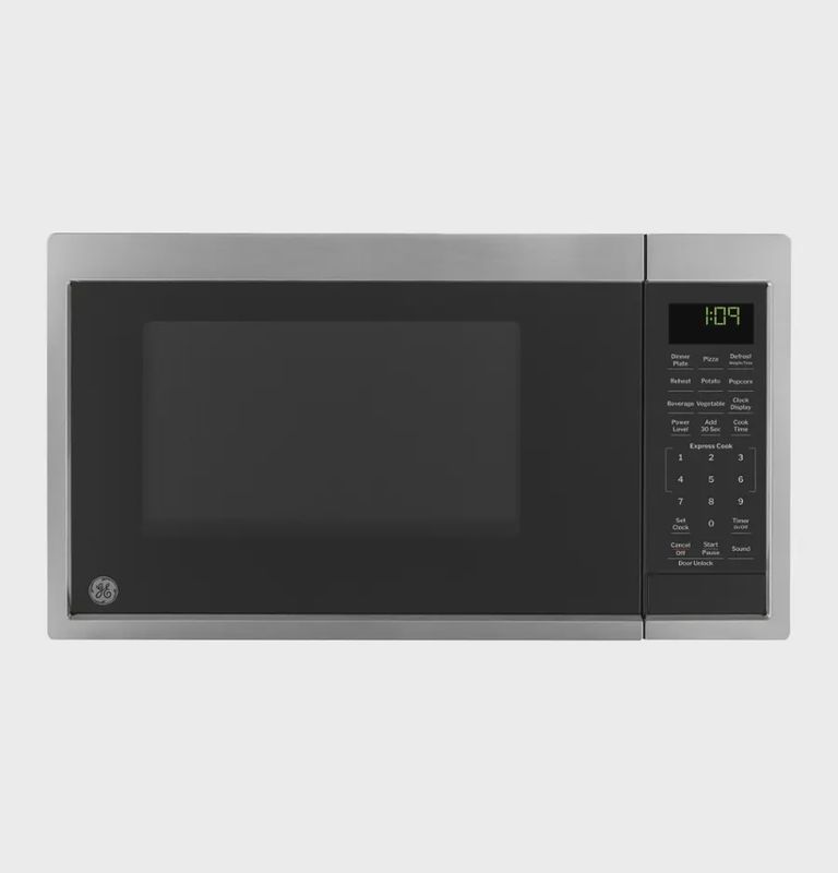 GE 0.9 Cu. Ft. countertop microwave oven in white with convenience cooking controls and compact design
