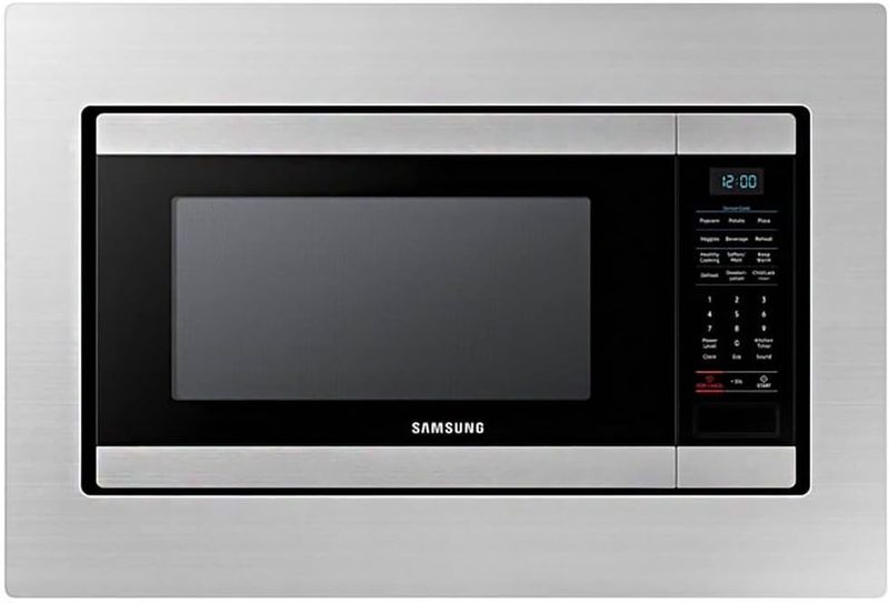 Samsung 30-inch trim kit fitted around the MS19M8000AS microwave, illustrating a seamless built-in kitchen setup.
