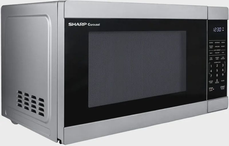 Side view of Sharp countertop microwave showing its sleek design and vents.