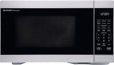 Sharp 1.1 cu. ft. countertop microwave with stainless steel finish, digital control panel, and windowed door.