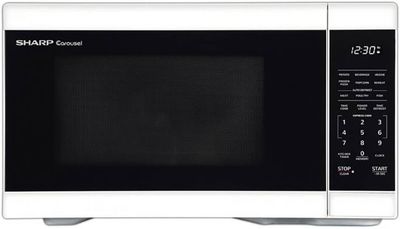 Sharp 1.1 cu. ft. White Countertop Microwave Oven with sleek exterior and digital control panel.