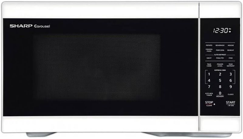 Sharp 1.1 cu. ft. White Countertop Microwave Oven with sleek exterior and digital control panel.