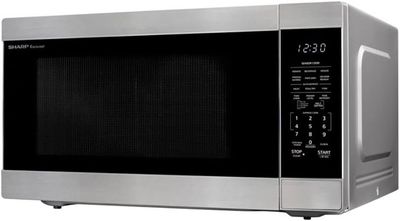 Left-side profile of the Sharp 2.2 cu ft microwave highlighting its depth and design.