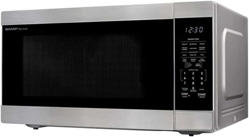 Left-side profile of the Sharp 2.2 cu ft microwave highlighting its depth and design.