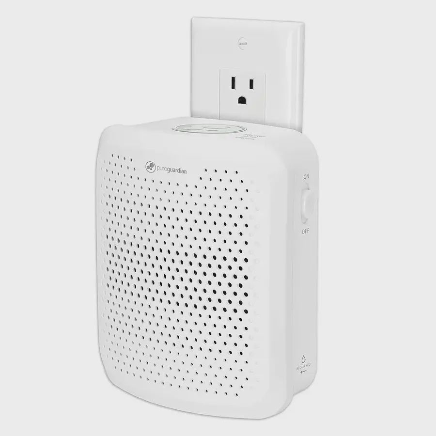 PureGuardian plug-in odor eliminating allergen air purifier with built‑in nightlight in white.