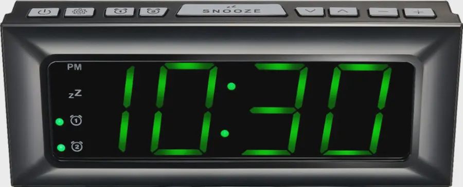 Close-up of Best Buy essentials™ BE-CLOPP3 Digital AM/FM Dual Alarm Clock showing green LED display and control buttons