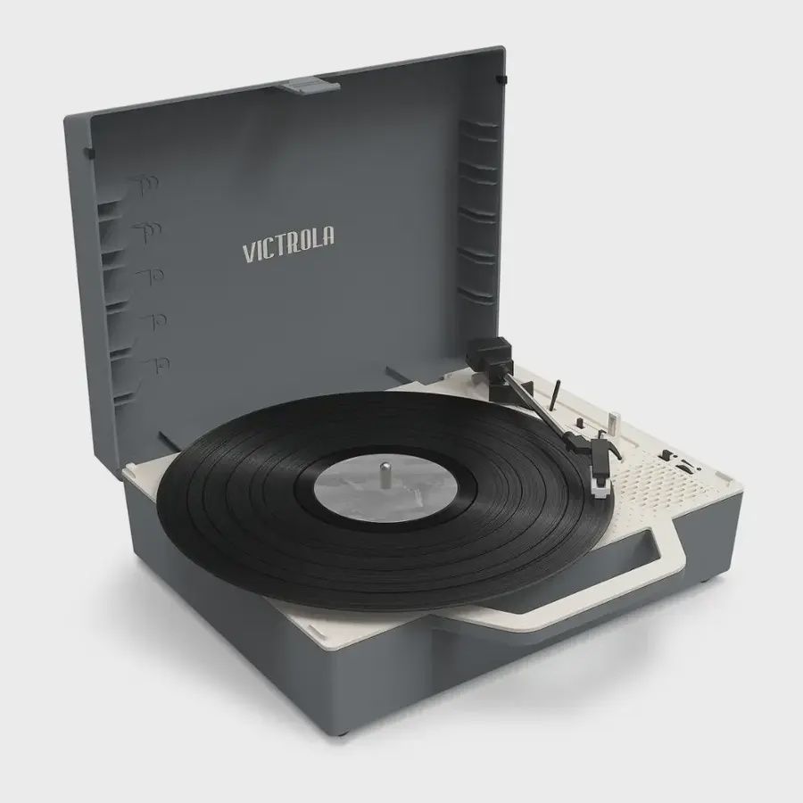 Front-facing image of the Victrola Re-Spin Suitcase Record Player with the lid open, revealing the platter and inner controls