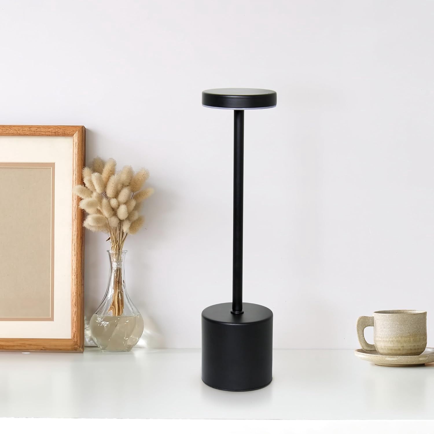 Desk lamp placed on a table in a living room setting.